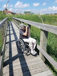 Zeiss-Birdability-appreciating_a_thoughtfully_designed_railing_on_an_accessible_trail